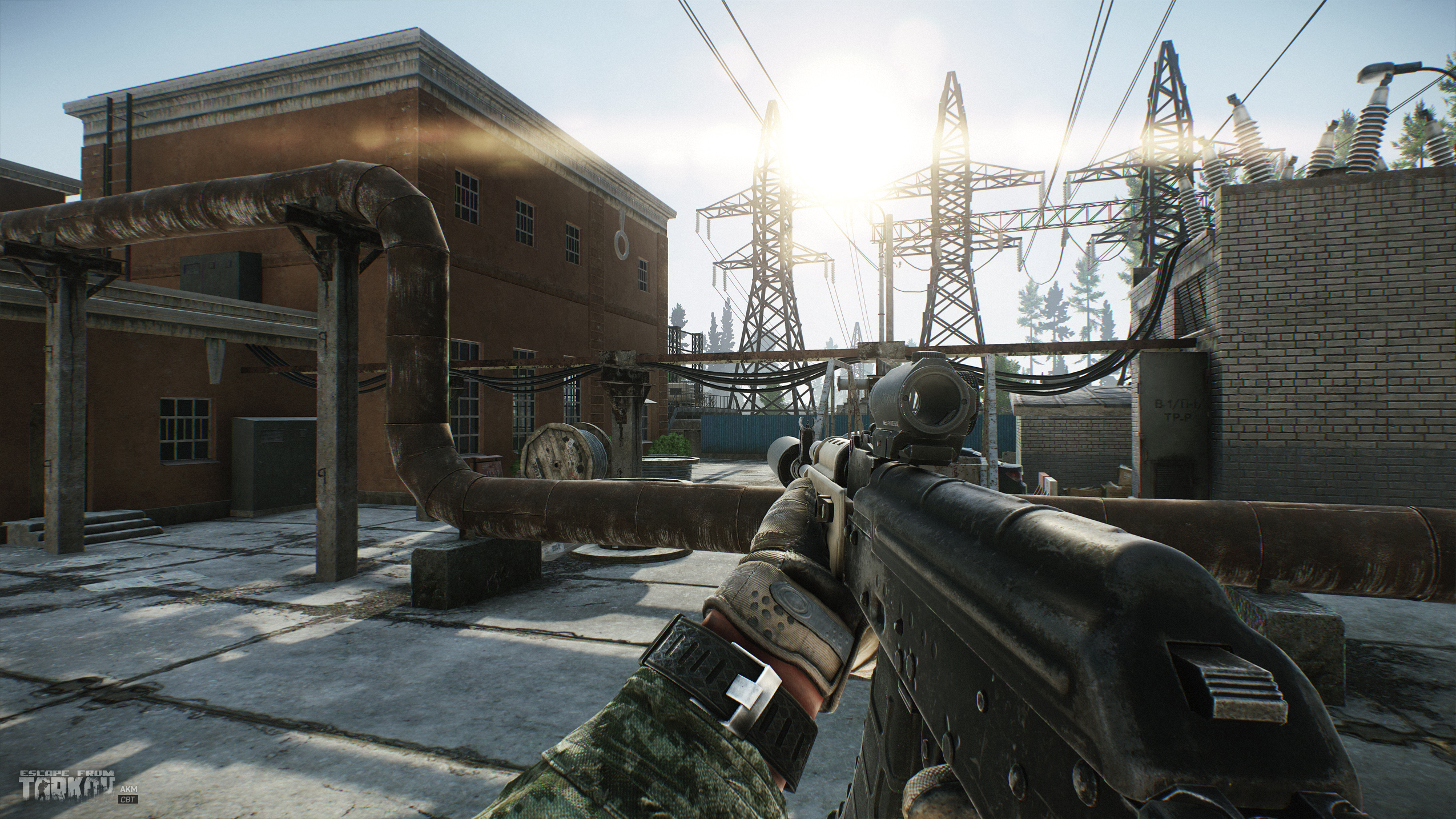 Player aiming a rifle in an industrial zone in Escape from Tarkov.